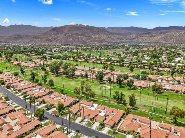 a view of a city with mountains in the background
