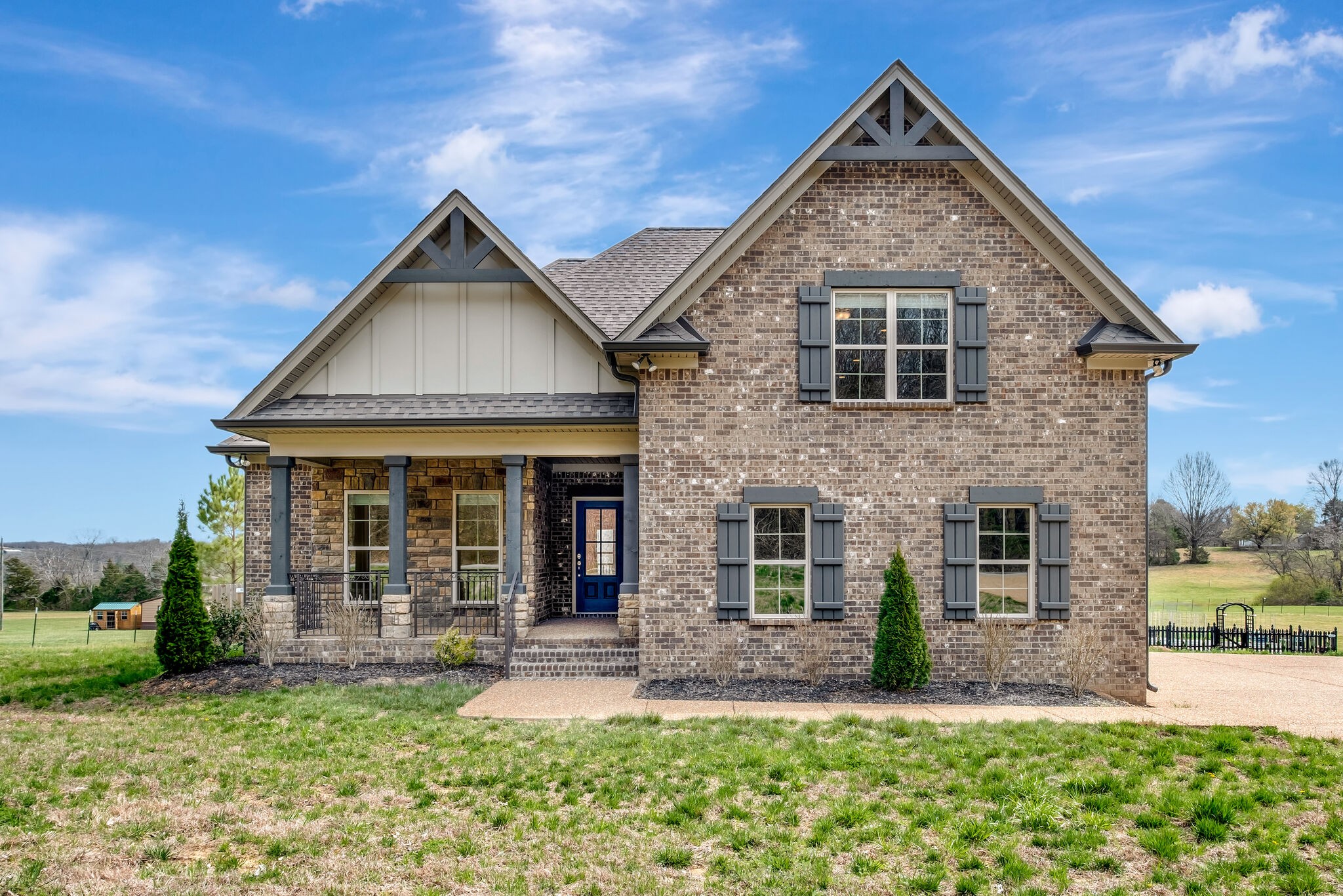 a front view of a house with a yard