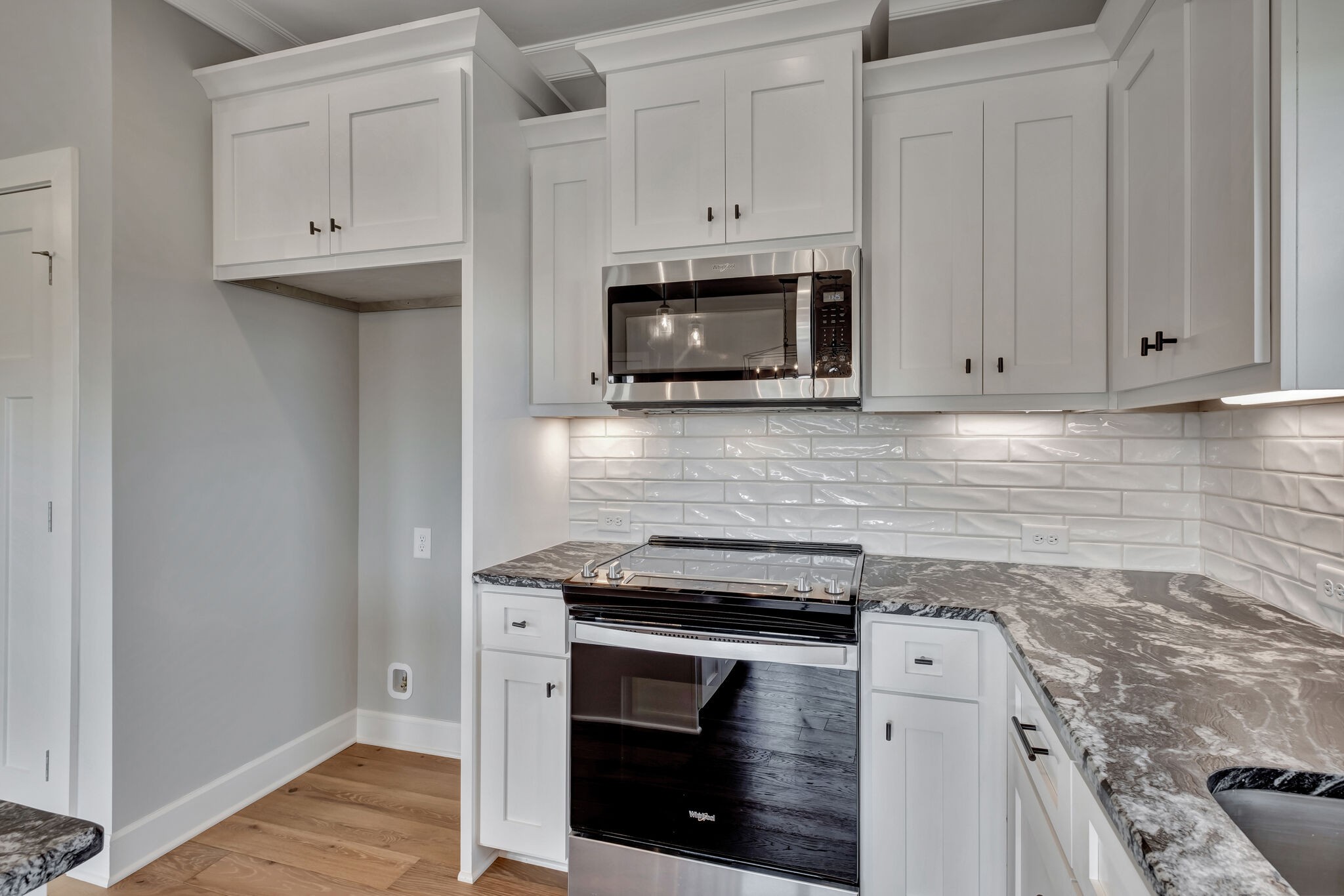 2511 Turner Road Watertown, TN 37184 - Photo 11 of 37 a kitchen with granite countertop white cabinets and stainless steel appliances