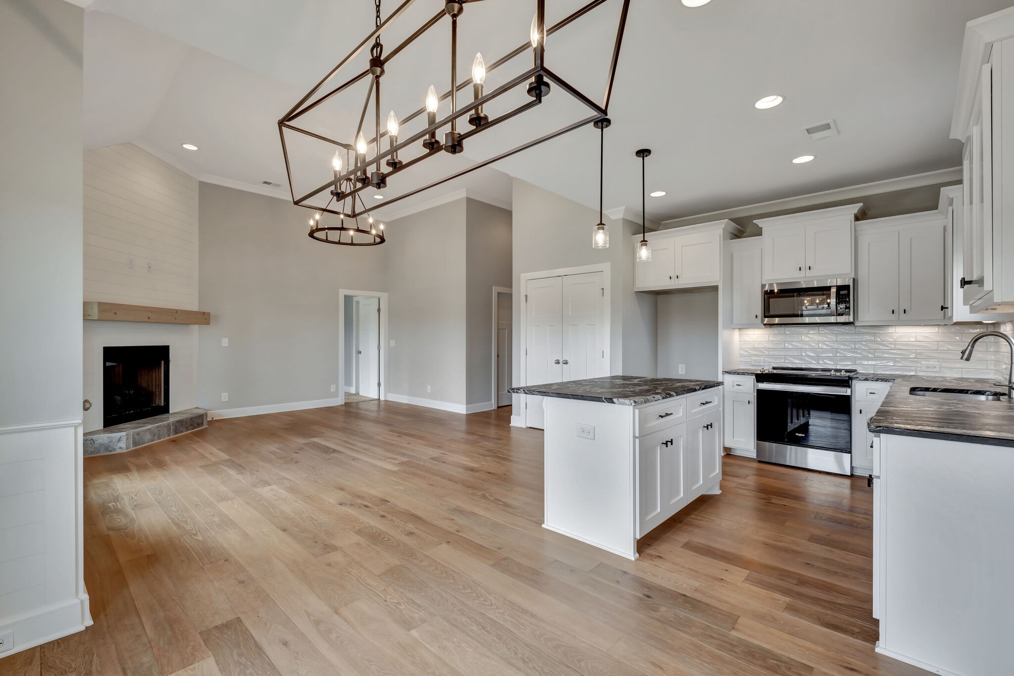 2511 Turner Road Watertown, TN 37184 - Photo 14 of 37 a kitchen with kitchen island granite countertop a stove a sink and a refrigerator