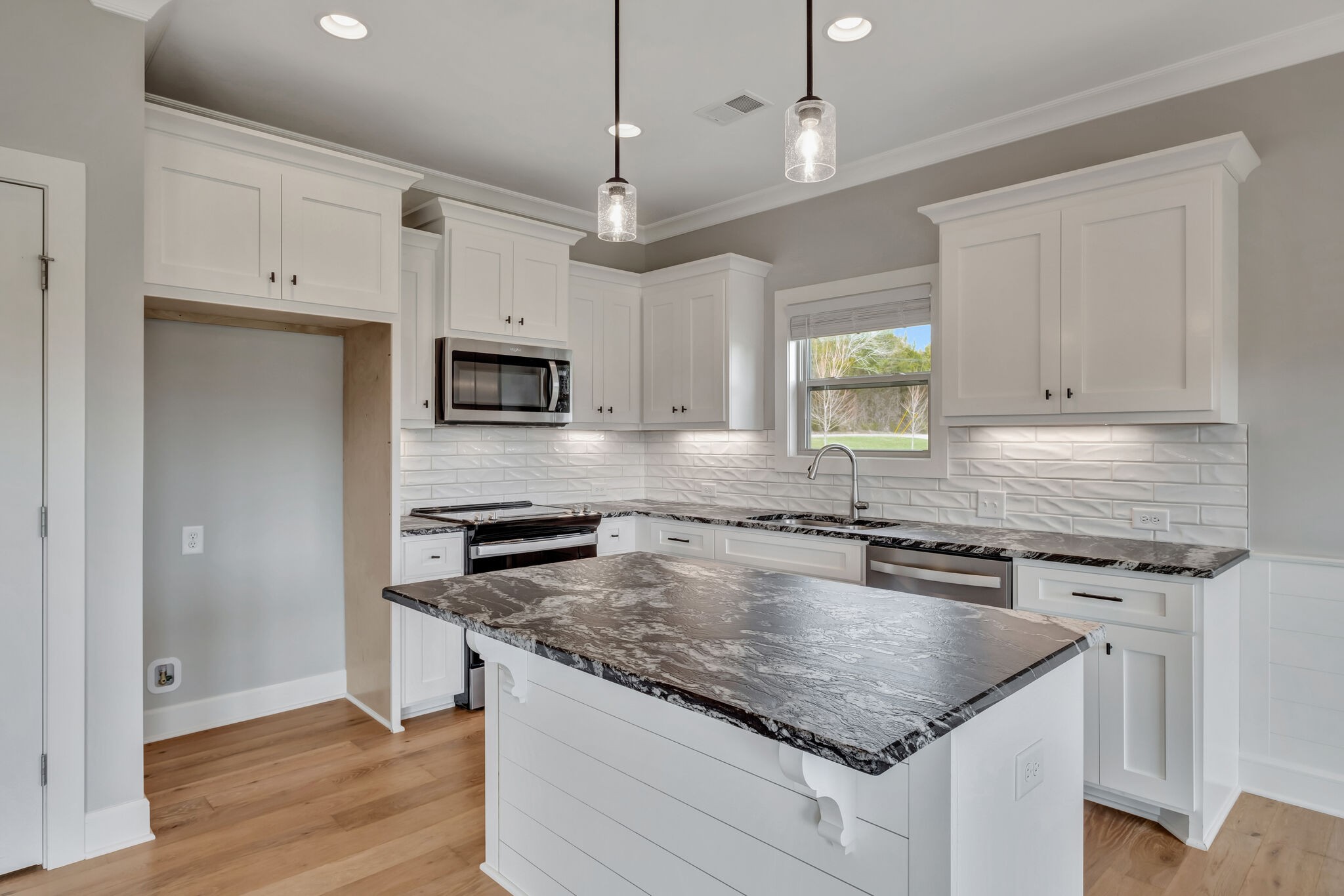 2511 Turner Road Watertown, TN 37184 - Photo 9 of 37 a kitchen with granite countertop a stove sink and microwave