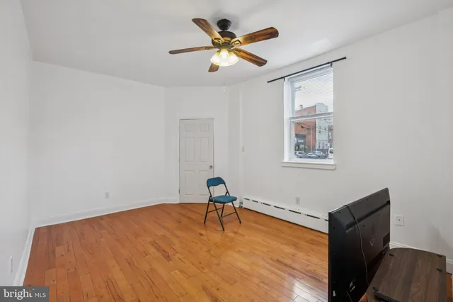 a room with window and ceiling fan