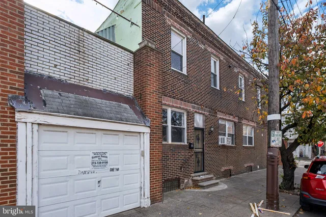 a front view of a house with a garage