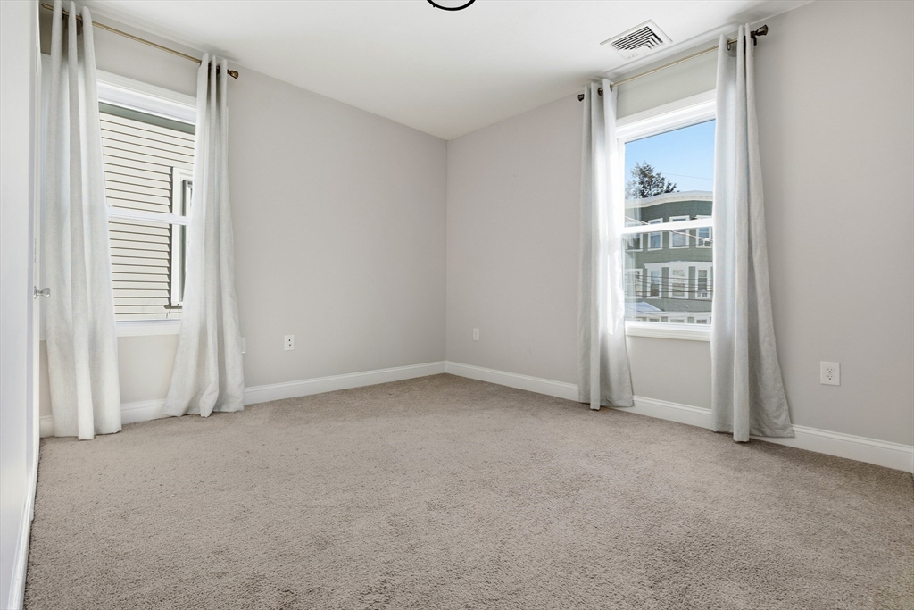 21 Emerton Street, Unit 2 Salem, MA 01970 - Photo 14 of 33 a view of an empty room with a window