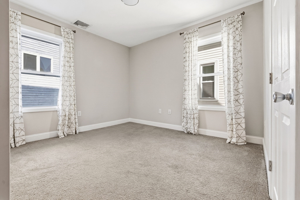 21 Emerton Street, Unit 2 Salem, MA 01970 - Photo 16 of 33 an empty room with windows
