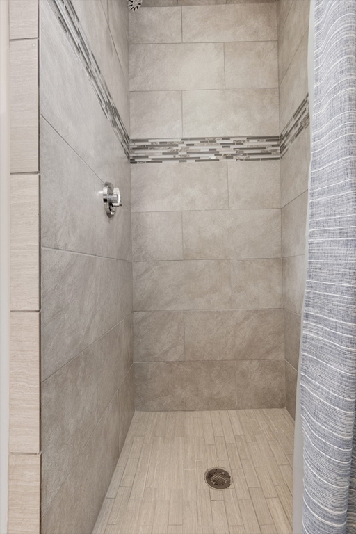 21 Emerton Street, Unit 2 Salem, MA 01970 - Photo 19 of 33 a bathroom with a glass shower door