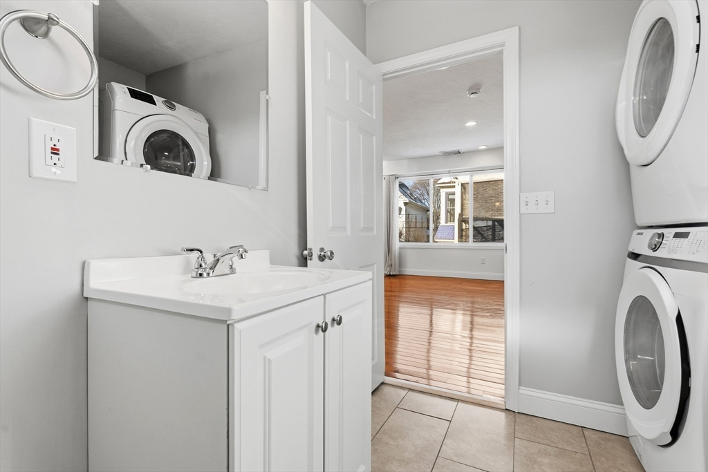21 Emerton Street, Unit 2 Salem, MA 01970 - Photo 20 of 33 a bathroom with a sink and a mirror