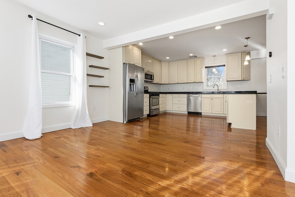 21 Emerton Street, Unit 2 Salem, MA 01970 - Photo 2 of 33 a view of kitchen with refrigerator microwave and stove