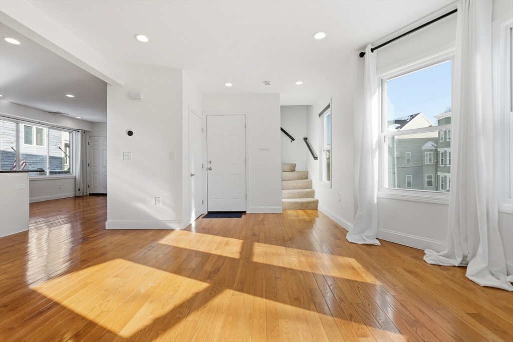 21 Emerton Street, Unit 2 Salem, MA 01970 - Photo 22 of 33 a view of an empty room with wooden floor and a window