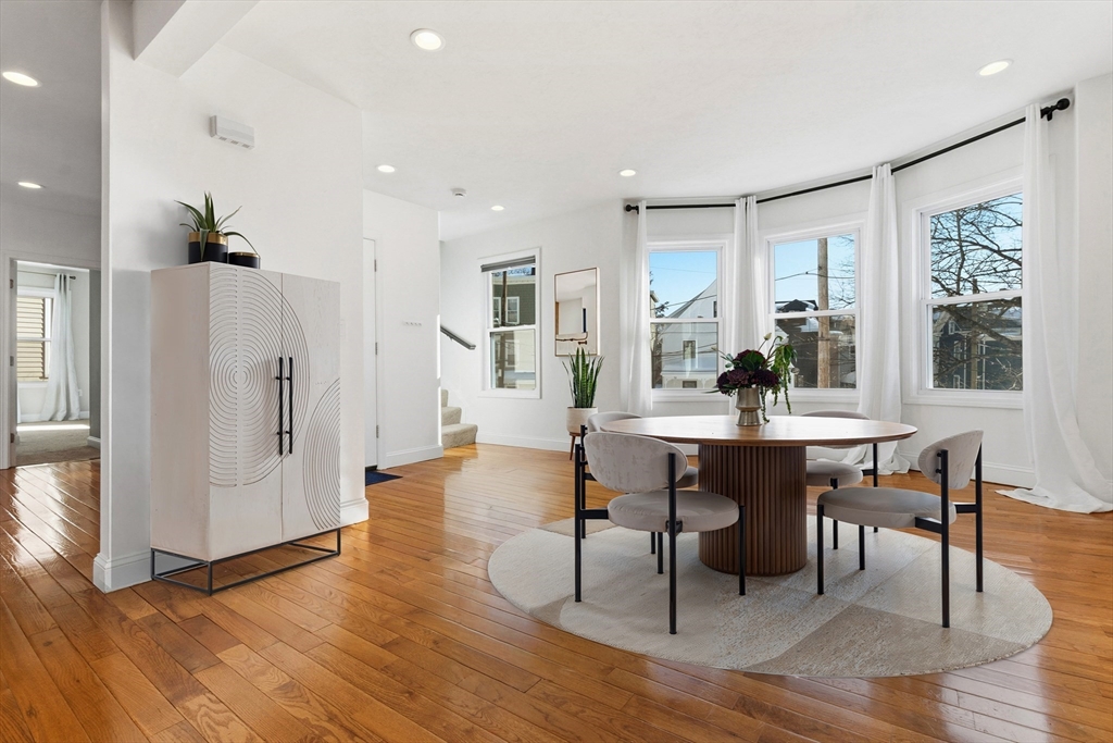 21 Emerton Street, Unit 2 Salem, MA 01970 - Photo 5 of 33 a view of a dining room with furniture and wooden floor