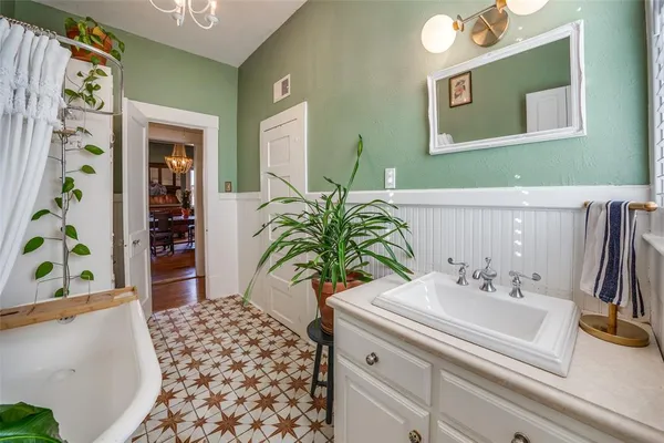 a bathroom with a sink a vanity and a mirror