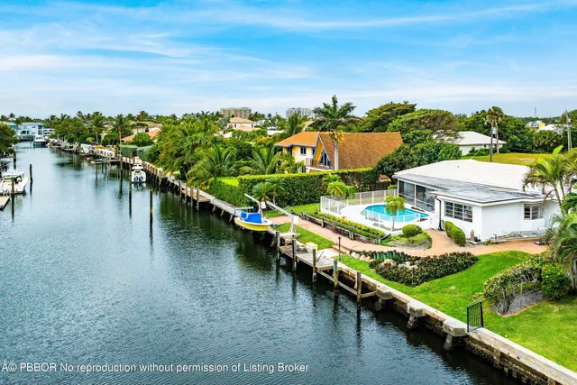 a view of residential houses with outdoor space and lake view
