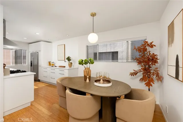 a kitchen with a table and chairs in it