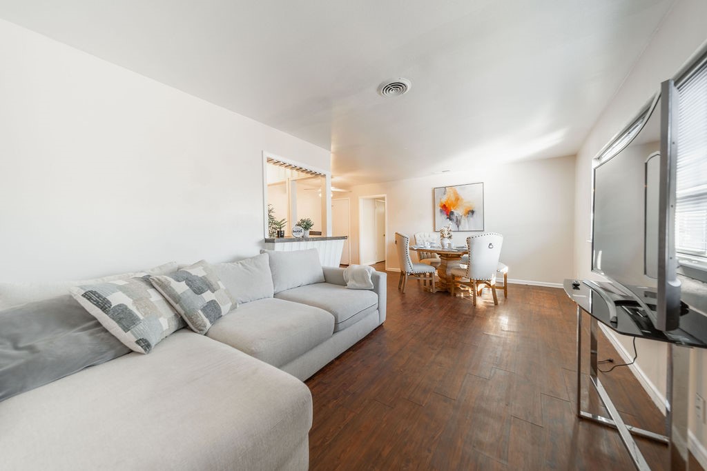 4723 Merwin Street Houston, TX 77027 - Photo 5 of 29 a living room with furniture and a couch