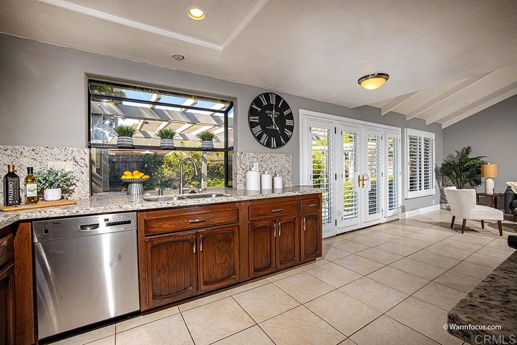 3797 Via Vuelta Rancho Santa Fe, CA 92091 - Photo 15 of 29 a kitchen with stainless steel appliances granite countertop a stove and a sink