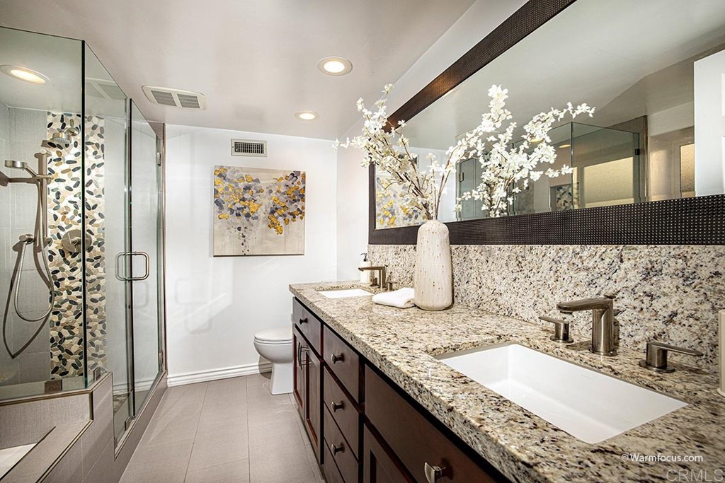 3797 Via Vuelta Rancho Santa Fe, CA 92091 - Photo 18 of 29 a bathroom with a granite countertop sink a toilet and mirror