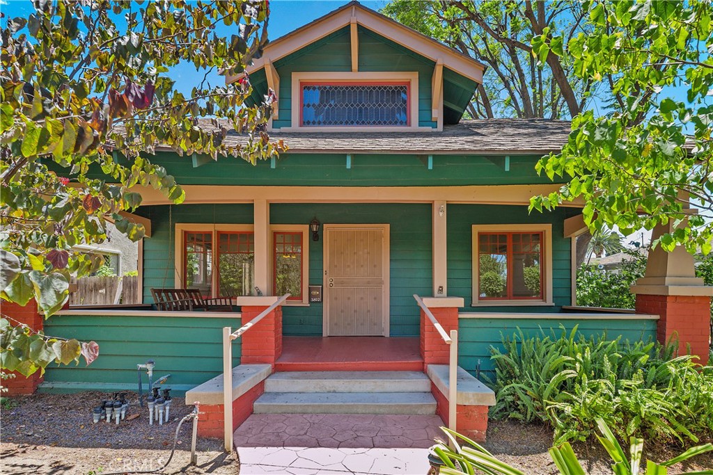 3892 Oakwood Place Riverside, CA 92506 - Photo 2 of 36 Beautiful exterior view showcasing the quintessential craftsman front porch and historical charm.