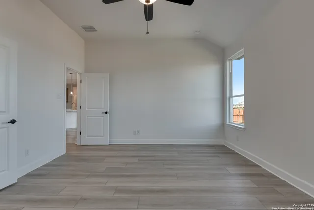 a view of a bathroom with tub shower sink and mirror