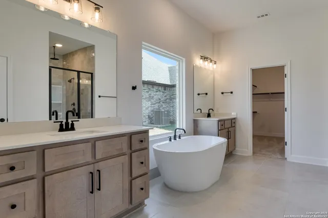 a bathroom with a glass shower door