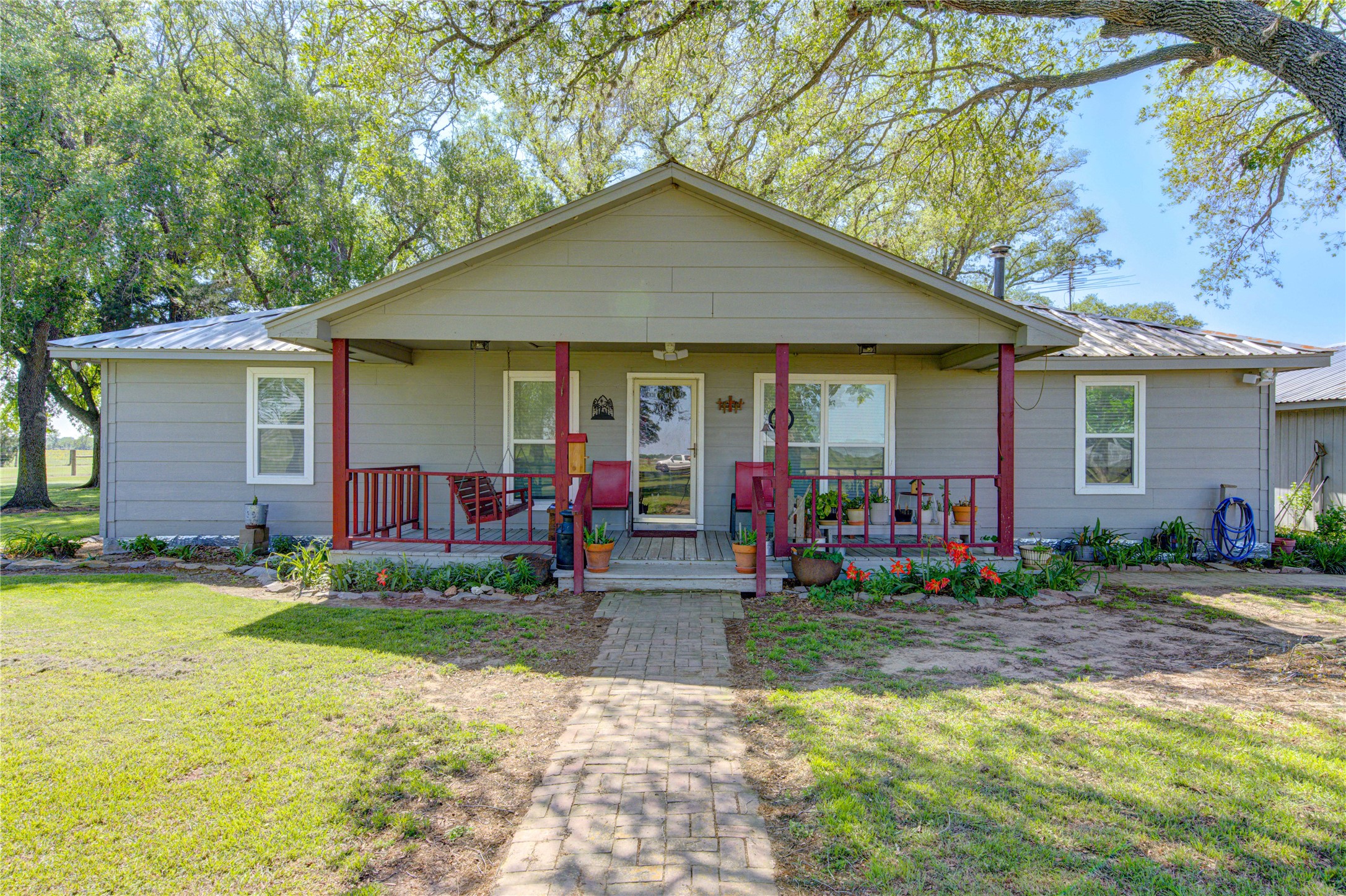 36239 Cochran Road Waller, TX 77484 - Photo 4 of 9 a front view of house with yard and trees in the background