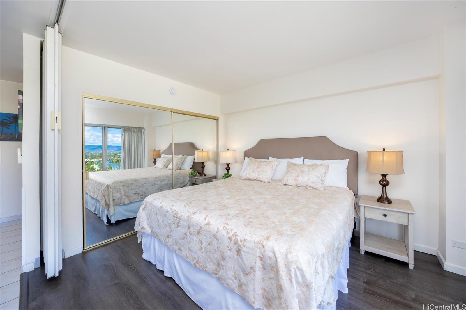 2161 Kalia Road, Unit 1012 Honolulu, HI 96815 - Photo 11 of 25 a bedroom with two beds and a night stand