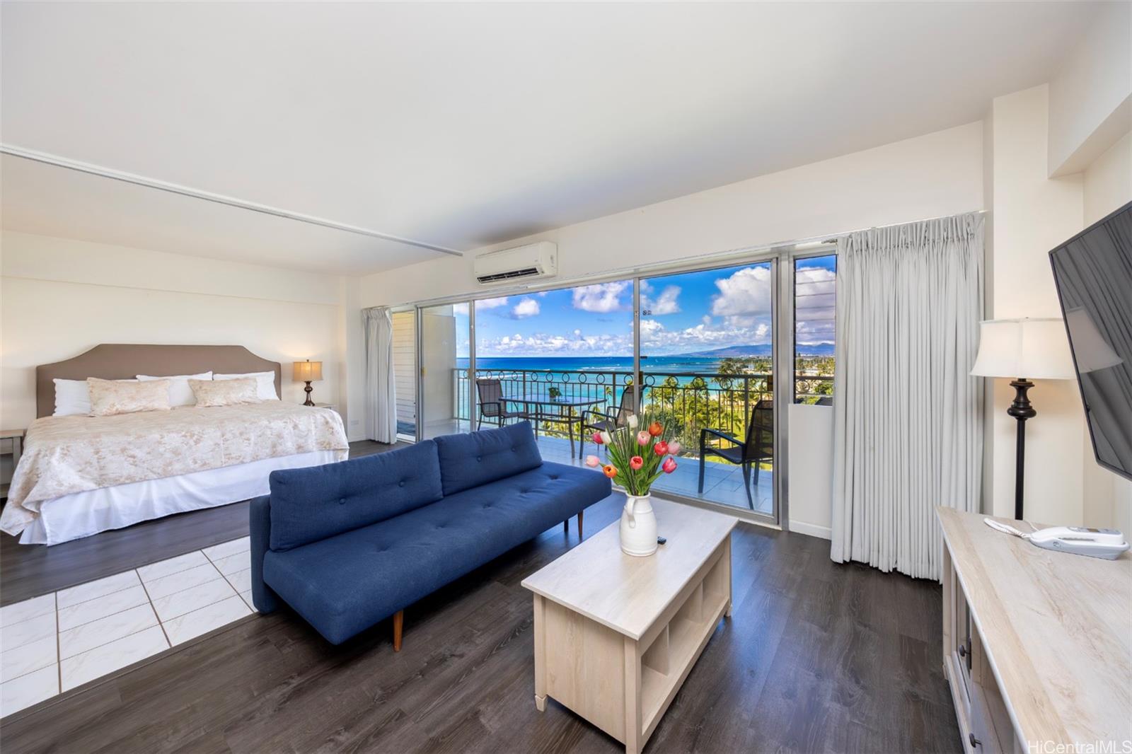 2161 Kalia Road, Unit 1012 Honolulu, HI 96815 - Photo 8 of 25 a living room with a couch and a table