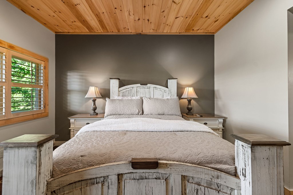 479 Big Timber Road Mineral Bluff, GA 30559 - Photo 20 of 60 a bedroom with a bed and a window