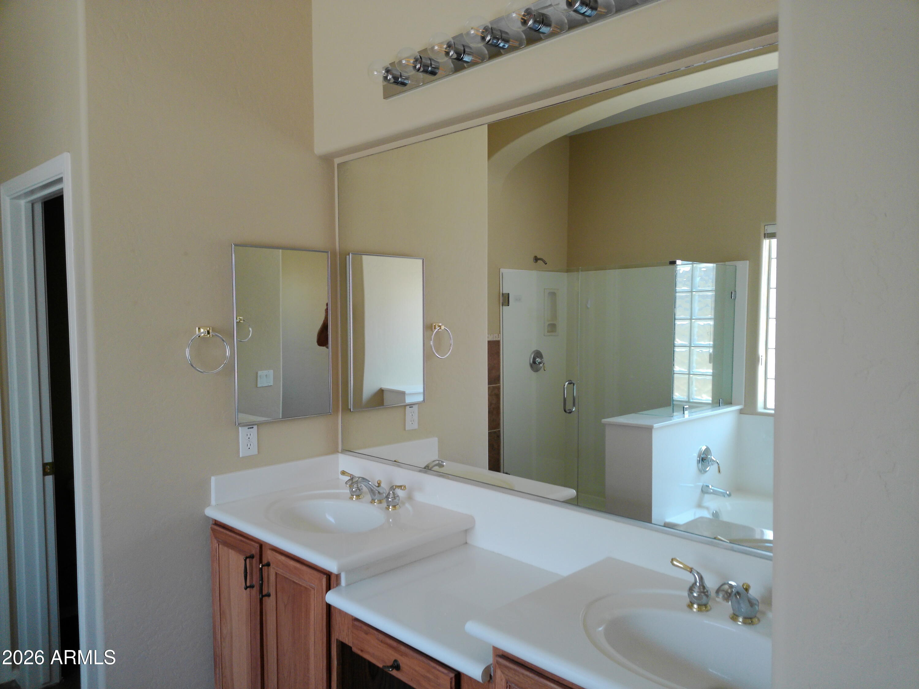 3018 West Sentinel Rock Road Phoenix, AZ 85086 - Photo 14 of 16 a bathroom with a granite countertop sink and a mirror