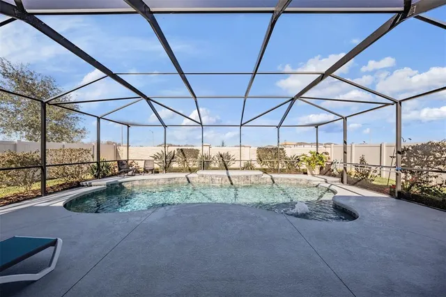 a view of a swimming pool with a patio