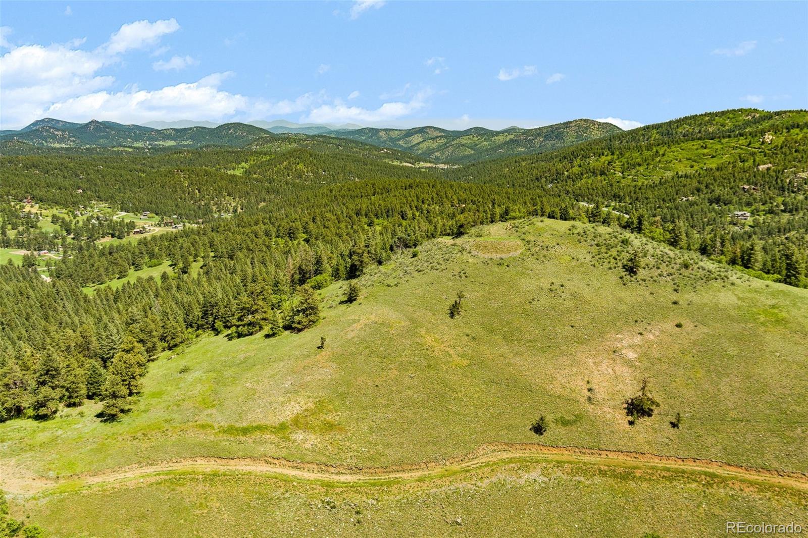 8529 South Deer Creek Canyon Road Morrison, CO 80465 - Photo 12 of 30 a view of a lake view and mountain view