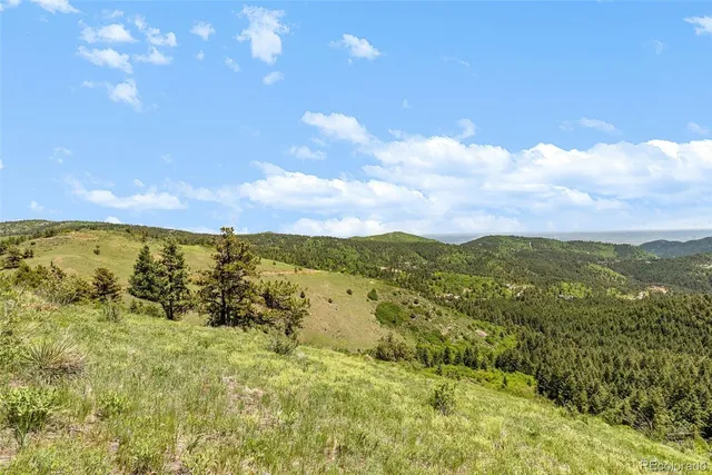 a view of mountain with sunset