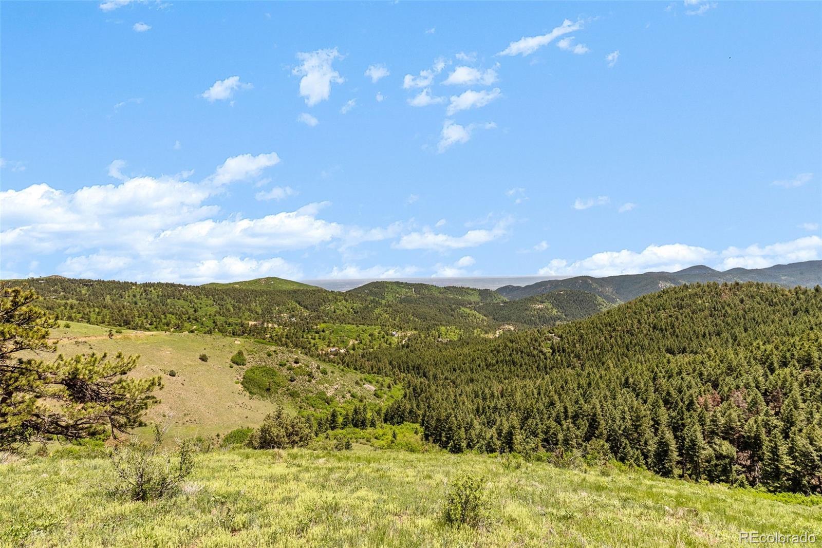 8529 South Deer Creek Canyon Road Morrison, CO 80465 - Photo 25 of 30 a view of lake and mountain