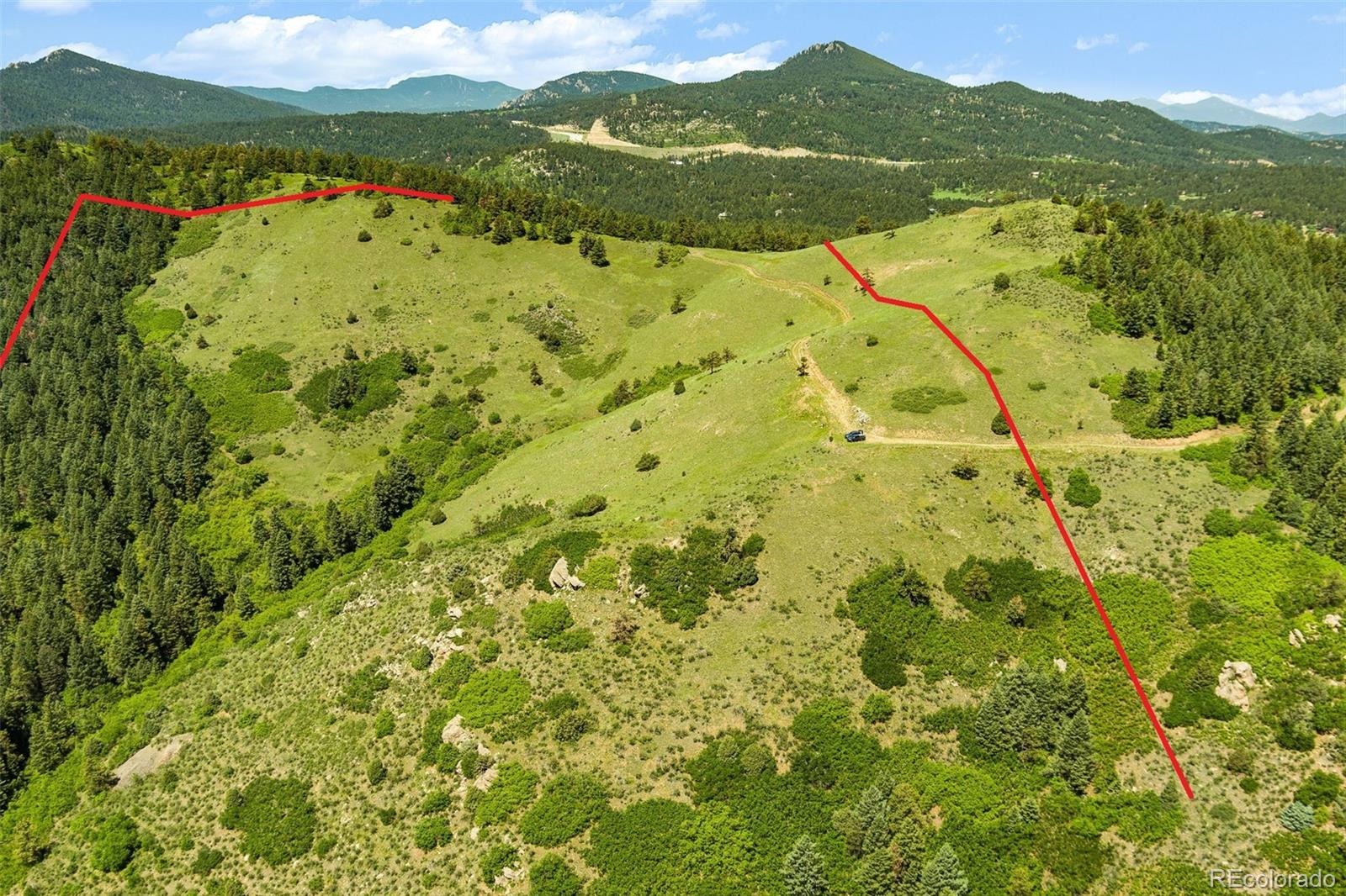 8529 South Deer Creek Canyon Road Morrison, CO 80465 - Photo 5 of 30 a view of lake with mountain
