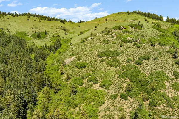 a view of a large mountain with a lake
