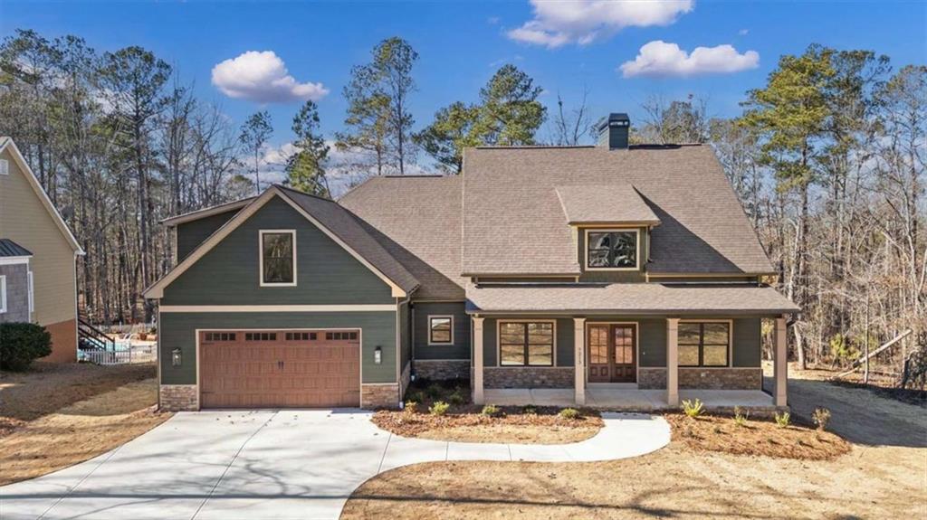 7213 Tara Drive Villa Rica, GA 30180 - Photo 1 of 42 a front view of a house with a yard and outdoor seating