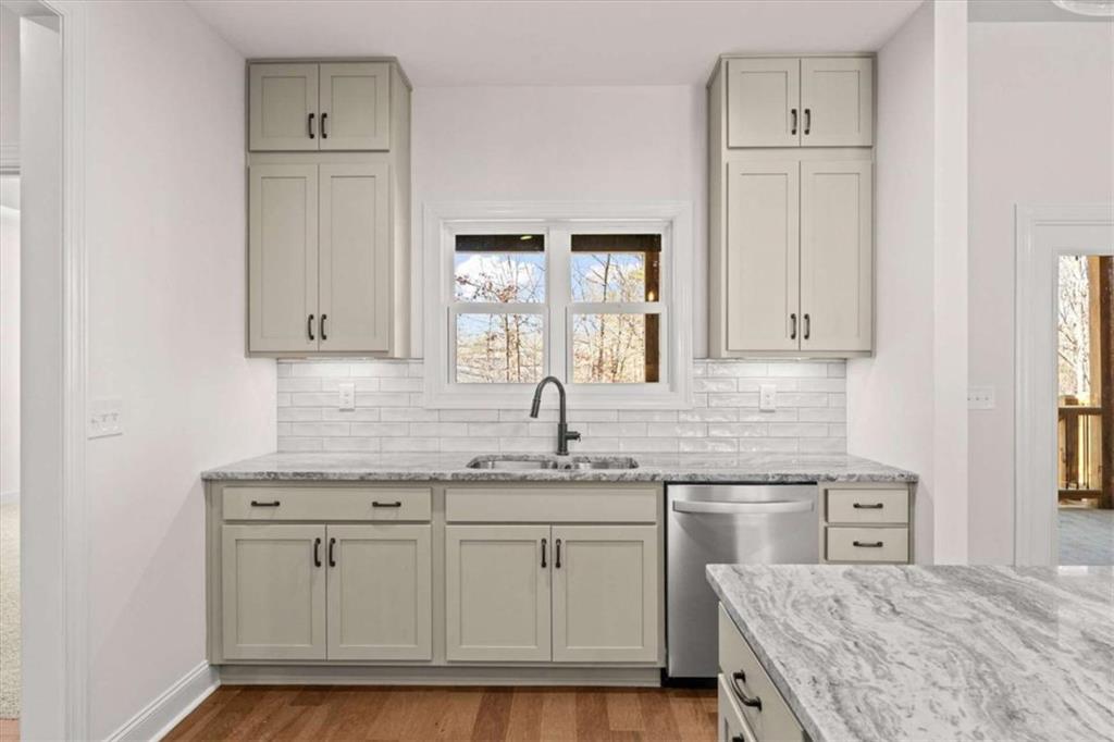 7213 Tara Drive Villa Rica, GA 30180 - Photo 13 of 42 a kitchen with white cabinets and sink