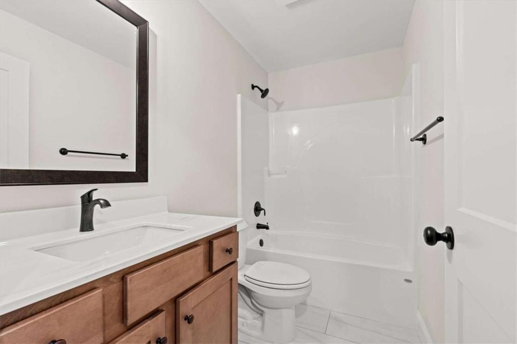 7213 Tara Drive Villa Rica, GA 30180 - Photo 28 of 42 a bathroom with a sink a toilet and shower