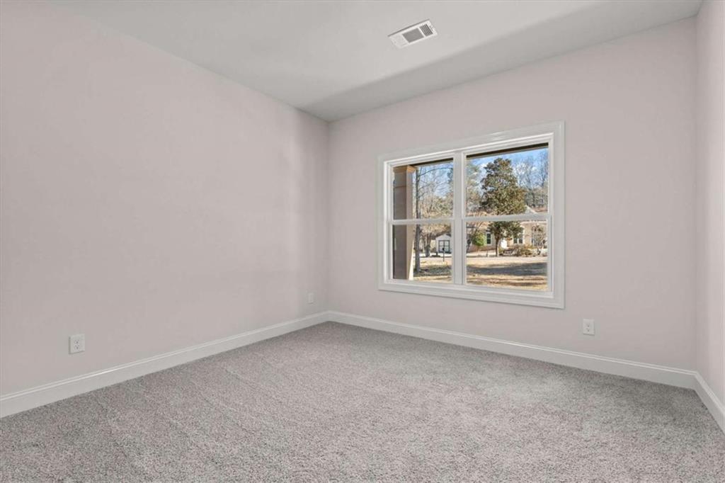 7213 Tara Drive Villa Rica, GA 30180 - Photo 29 of 42 an empty room with windows