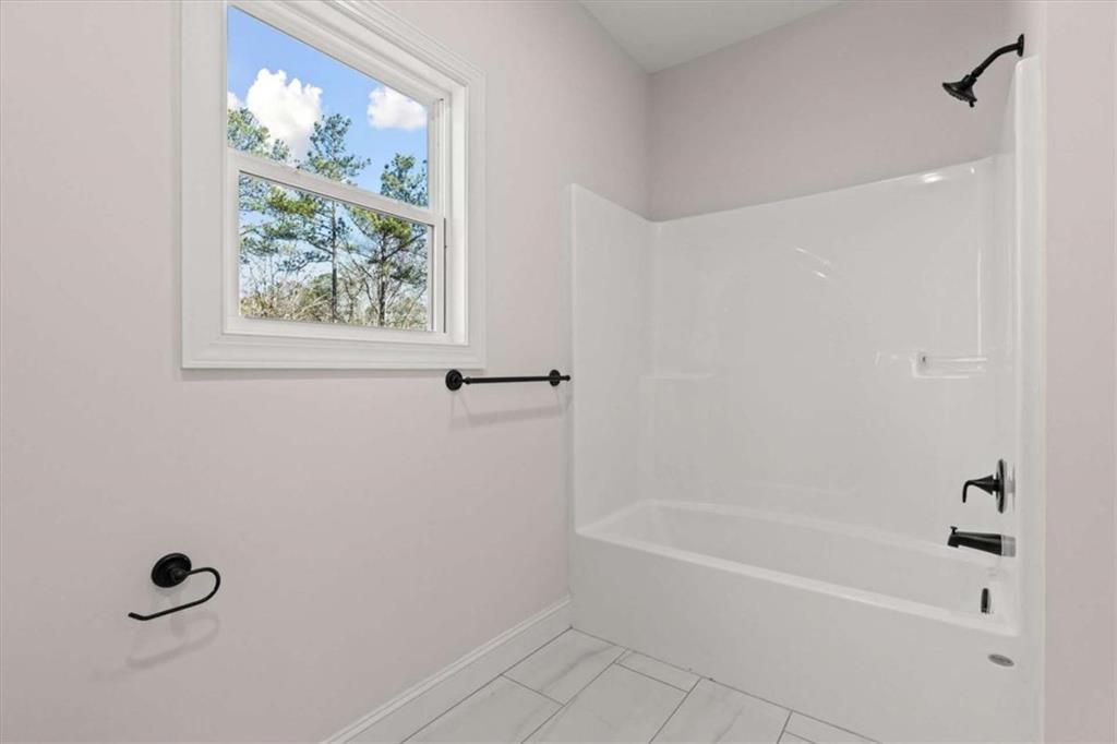 7213 Tara Drive Villa Rica, GA 30180 - Photo 31 of 42 a bathroom with a bathtub