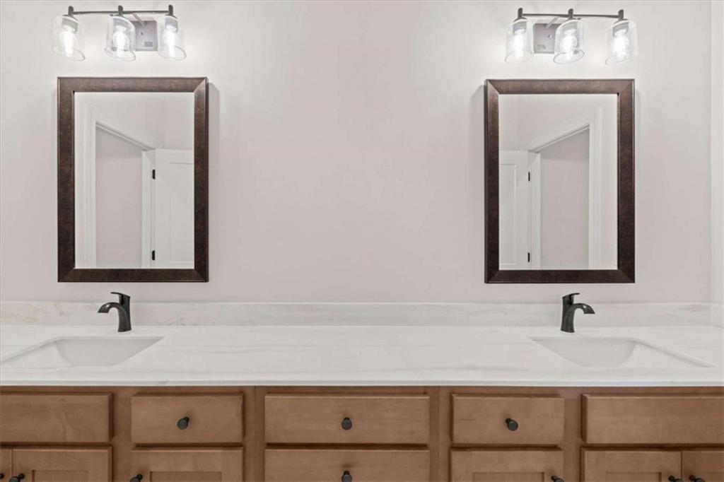 7213 Tara Drive Villa Rica, GA 30180 - Photo 32 of 42 a bathroom with a sink vanity and a mirror