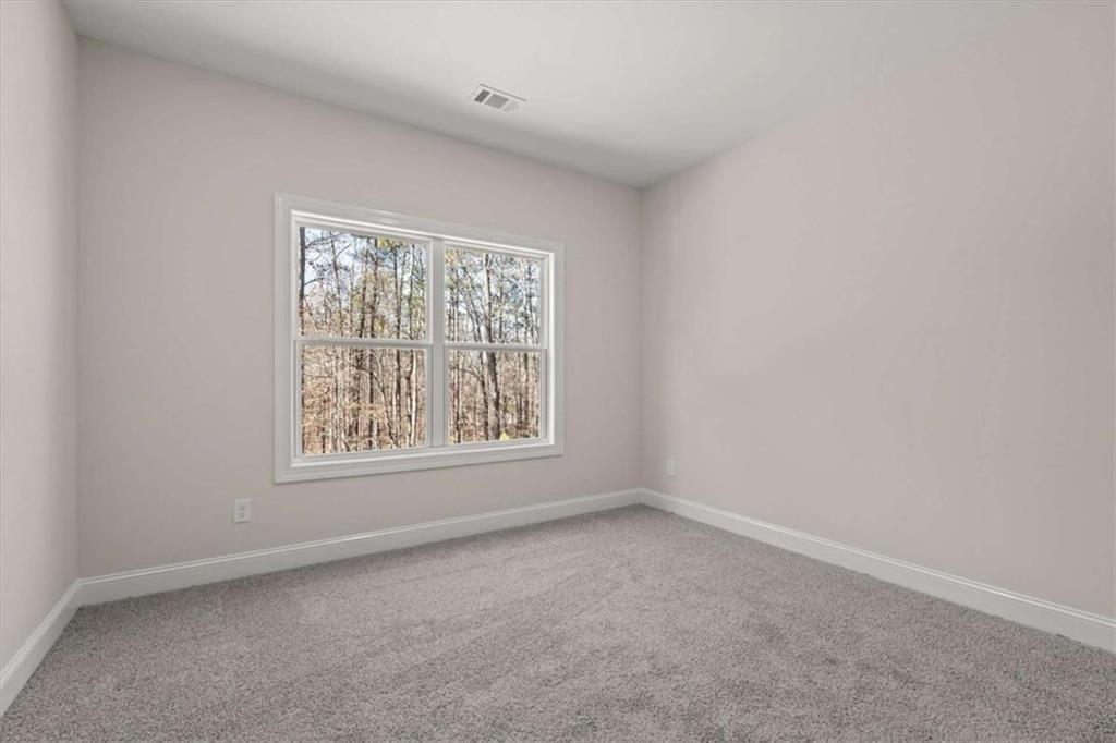 7213 Tara Drive Villa Rica, GA 30180 - Photo 33 of 42 an empty room with a window