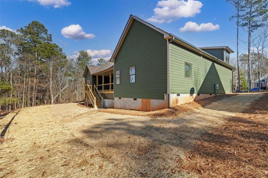 7213 Tara Drive Villa Rica, GA 30180 - Photo 38 of 42 a front view of a house with a yard and garage