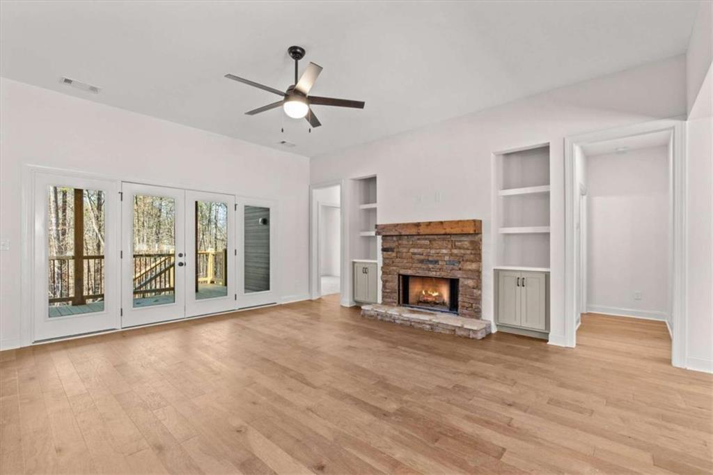 7213 Tara Drive Villa Rica, GA 30180 - Photo 10 of 42 a view of an empty room with a fireplace and a window