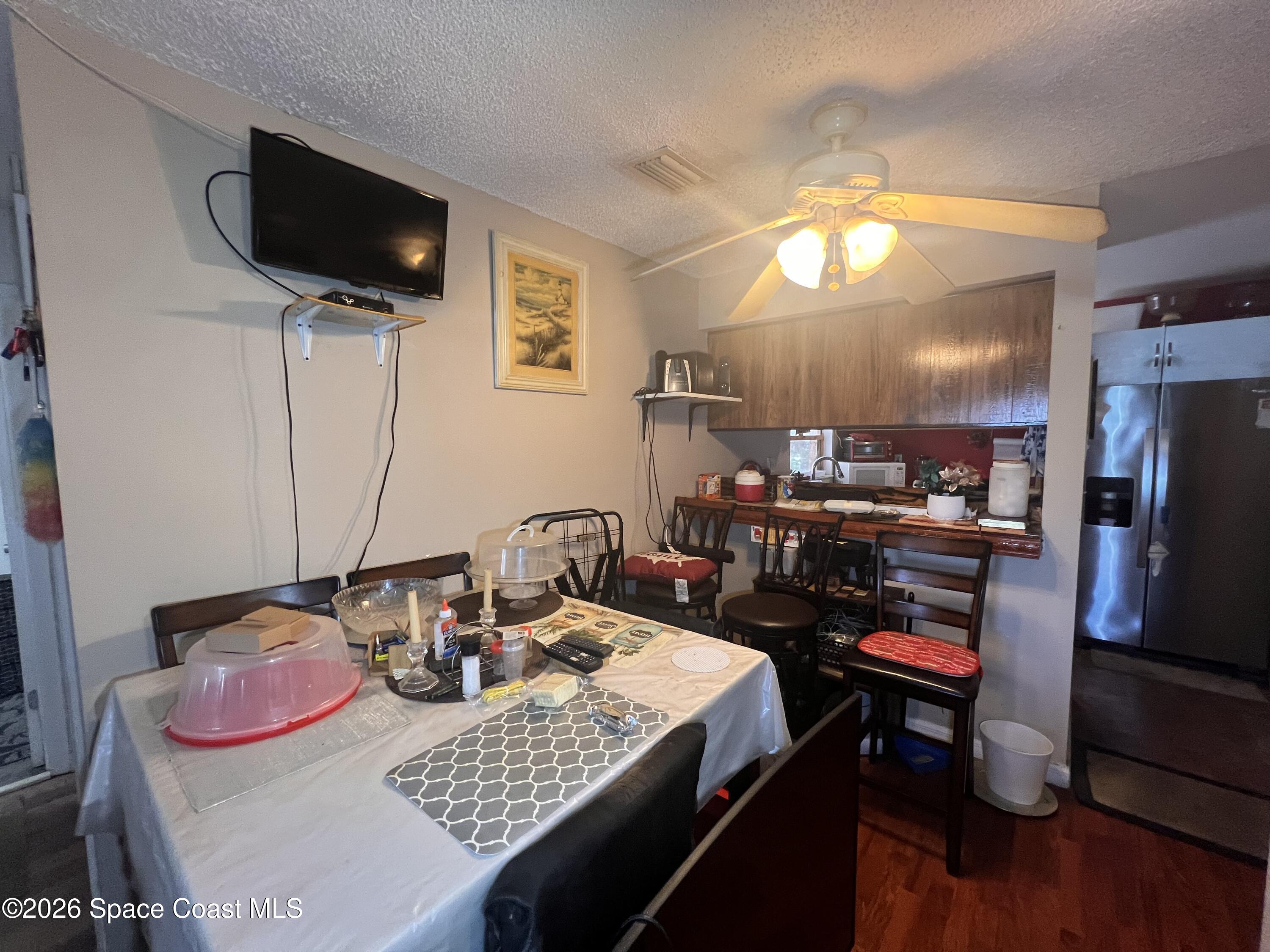 1225 North Wickham Road, Unit 623 Melbourne, FL 32935 - Photo 13 of 20 a view of a dining room with furniture
