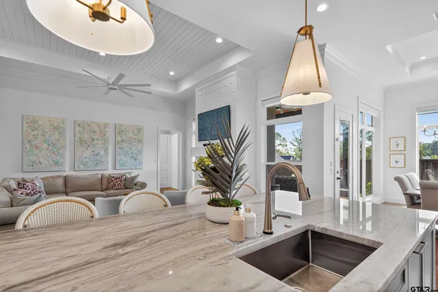 a kitchen with stainless steel appliances sink stove and cabinets
