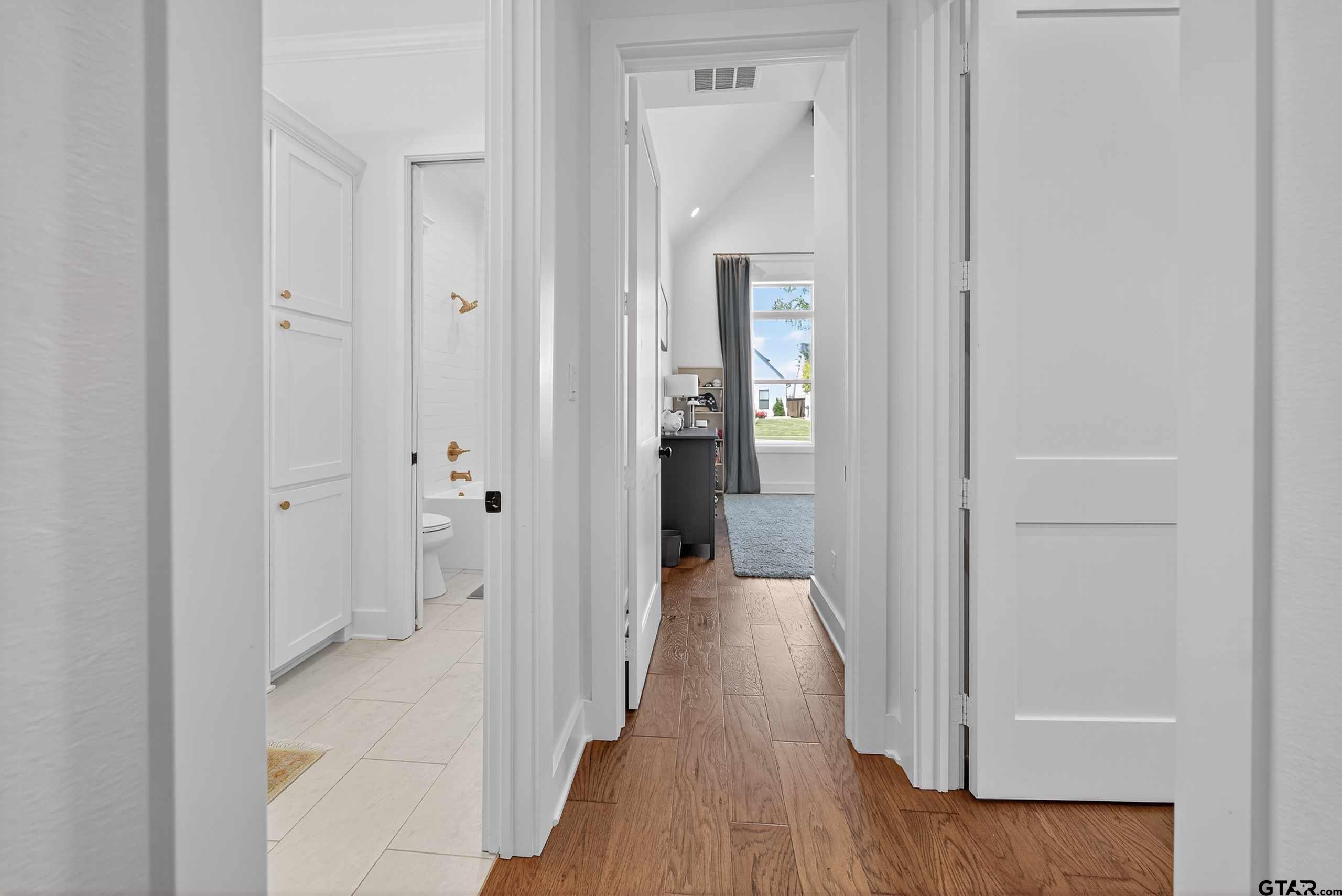 1572 Maple Lane Tyler, TX 75703 - Photo 28 of 47 a view of a hallway with wooden floor