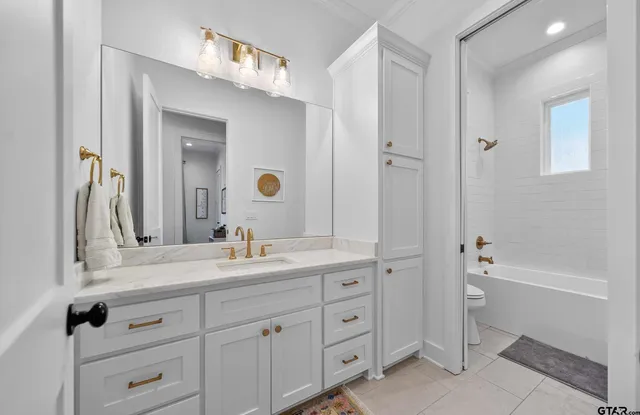 a bathroom with a tub and shower