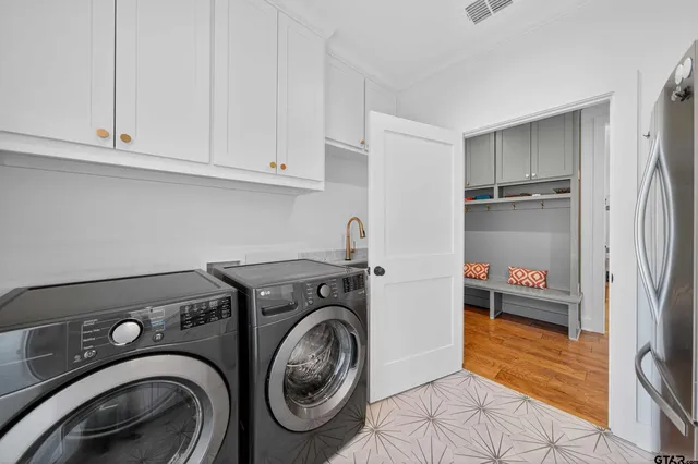 a bathroom with a toilet a sink and a mirror