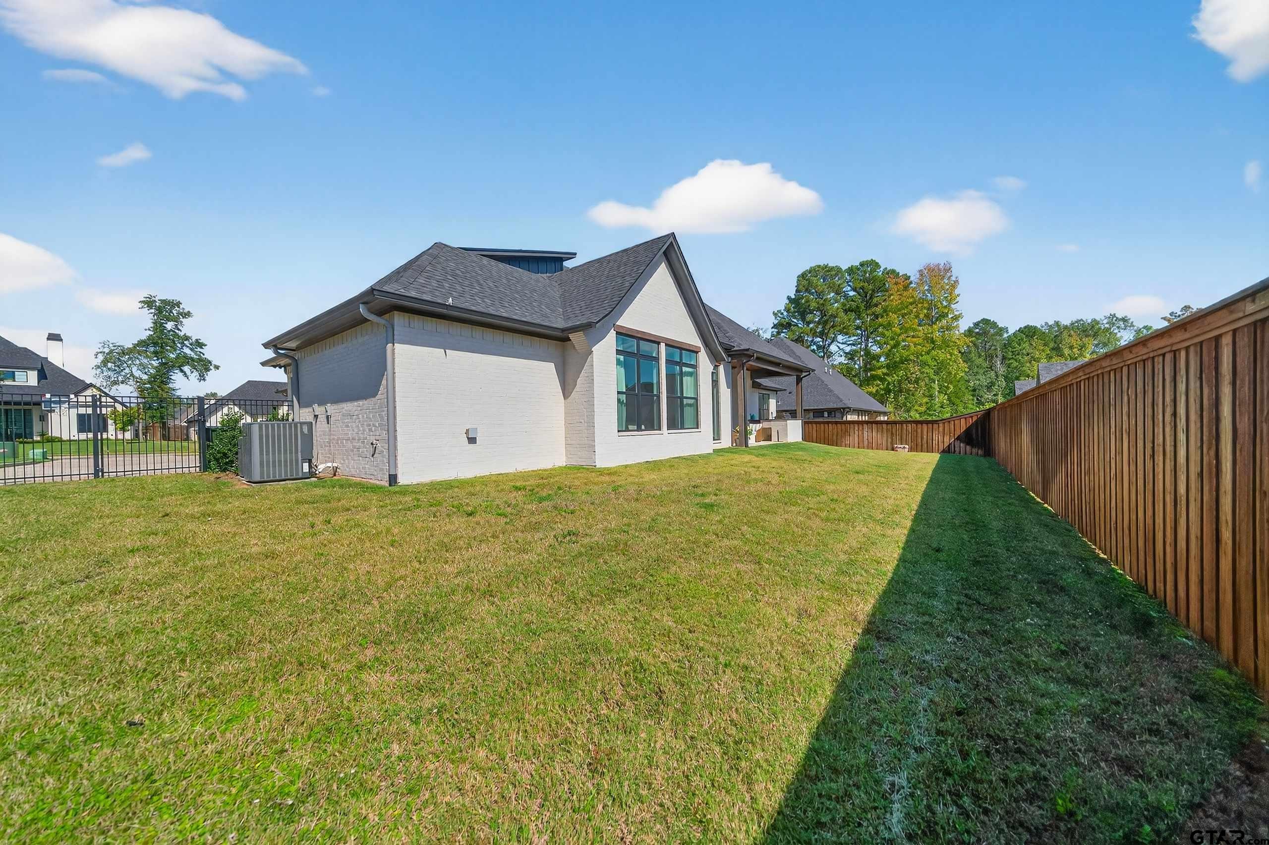 1572 Maple Lane Tyler, TX 75703 - Photo 46 of 47 a view of a house with backyard and trees