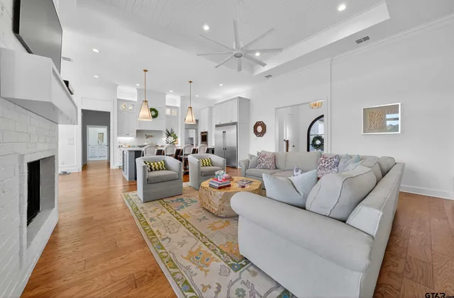 a living room with furniture and a fireplace